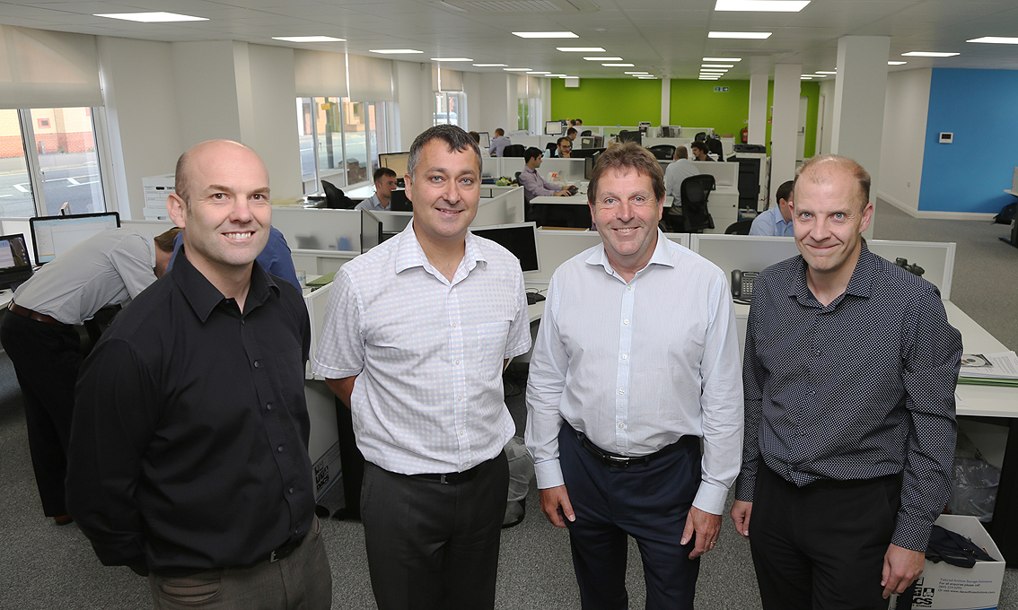 Rodgers Leask Directors: (left to right) Stewart Friel, Lawrence Pacey, Andy Leask and Paul Spencer with staff at their new Derby premises.