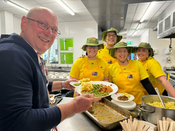 Law firm staff cook up a ‘bonzer’ meal for the community