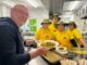 Law firm staff cook up a ‘bonzer’ meal for the community