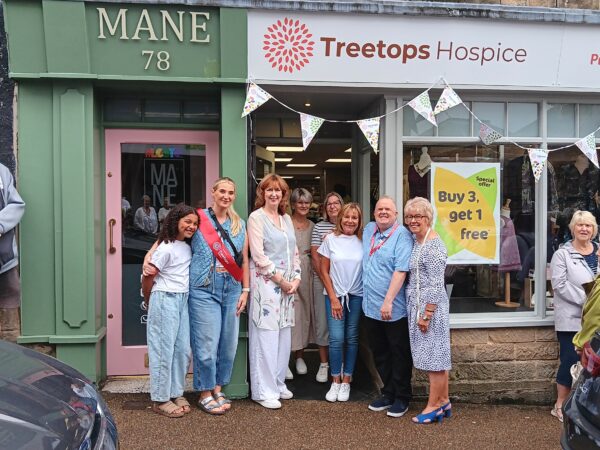 Hospice cuts ribbon on latest charity shop