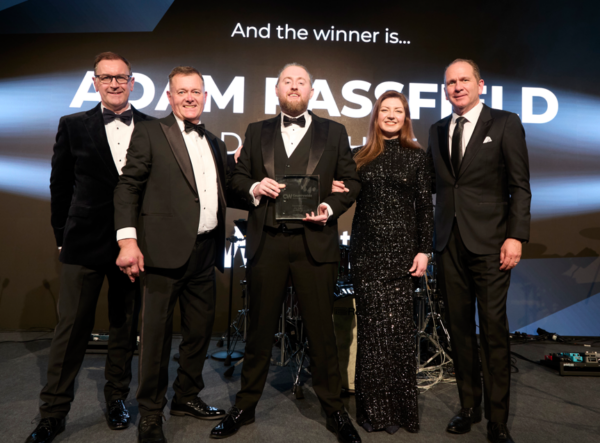 Adam digs his award for being top franchisee